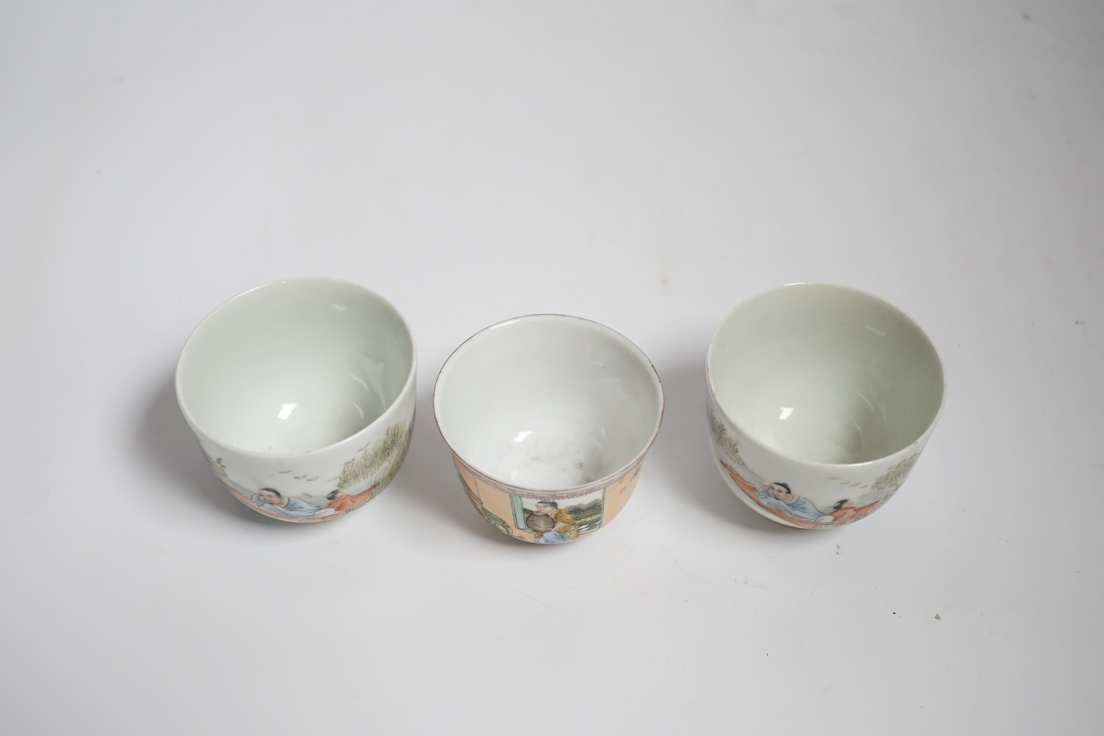 Three Chinese enamelled porcelain tea bowls, largest 5cm high